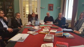 Visit at the Zsolnay publishing house. Observing from the corner to the right, its editor-in chief Mr Herbert Ohrlinger. Photo:  Marko Kovič